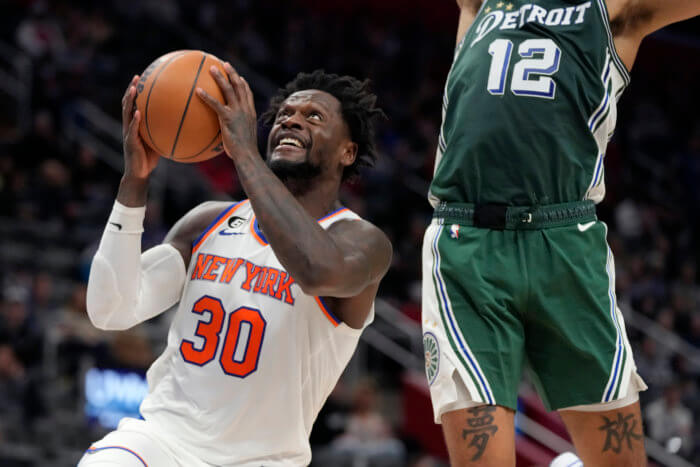 Knicks forward Julius Randle attempts a layup as Pistons forward Isaiah Livers defends during the second half.