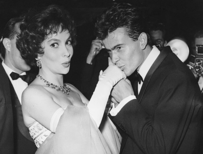 German actor Horst Buchholz kisses the hand of Italian actress Gina Lollobrigida, during the International Film Festival (Berlinale) in Berlin, Germany