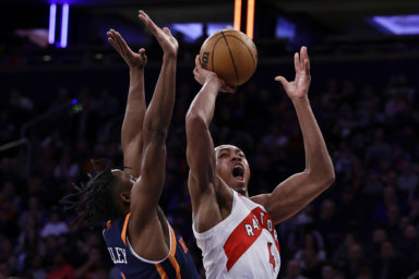 Scottie Barnes finishes against the Knicks