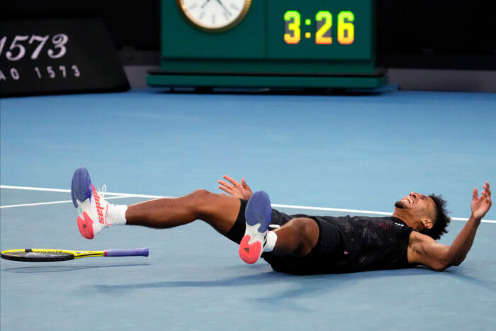 Michael Mmoh celebrates a huge win at the Australian Open