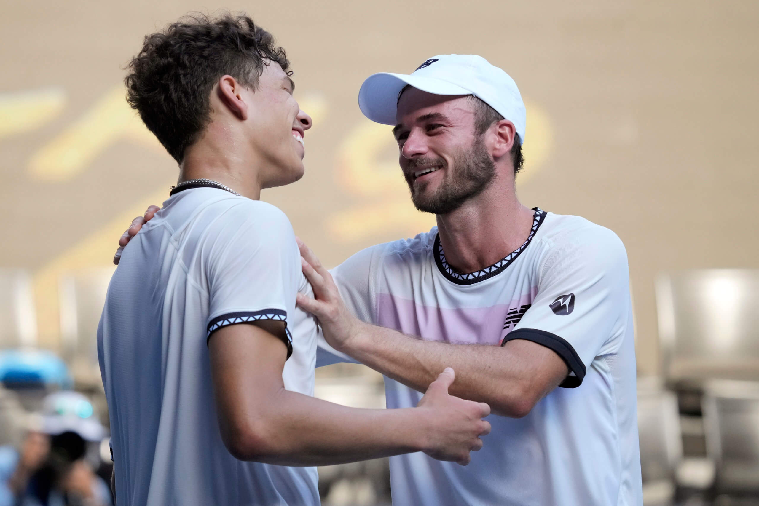 Tommy Paul and Ben Shelton talk after their match