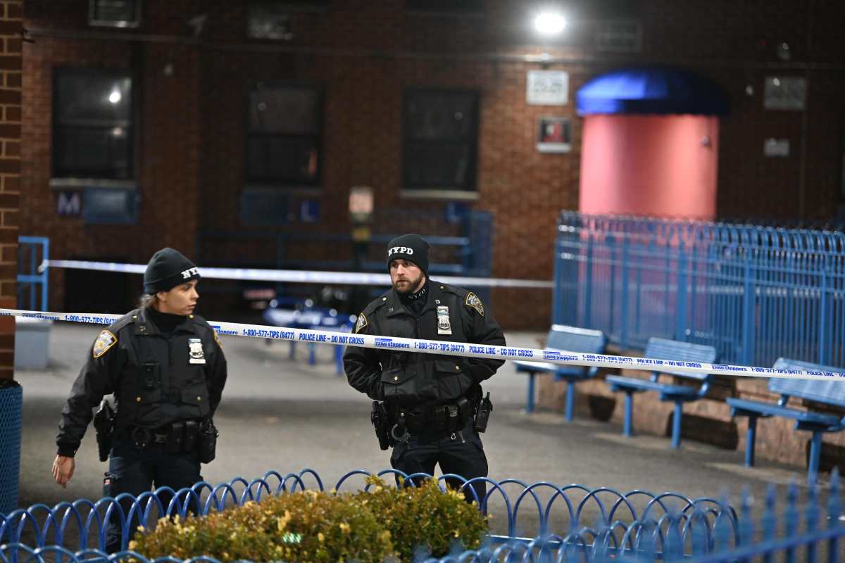 Officers inspect the crime scene