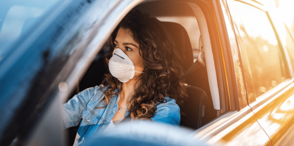 A woman driving in an Uber or Lyft