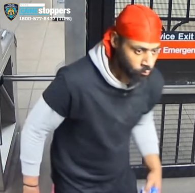 A surveillance photo of a man wanted for trying to rape a woman in a Queens bathroom