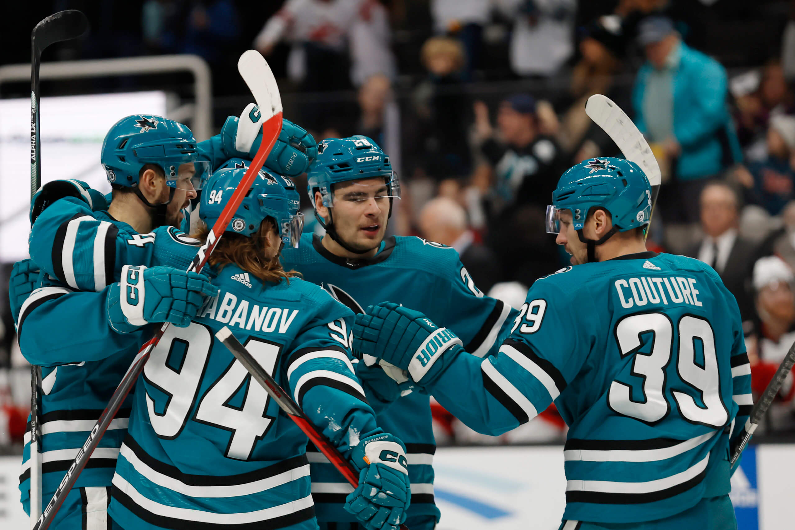 San Jose Sharks center Logan Couture, right, celebrates with right wing Timo  Meier (28) after scoring a goal against the Vegas Golden Knights during the  first period of an NHL hockey game