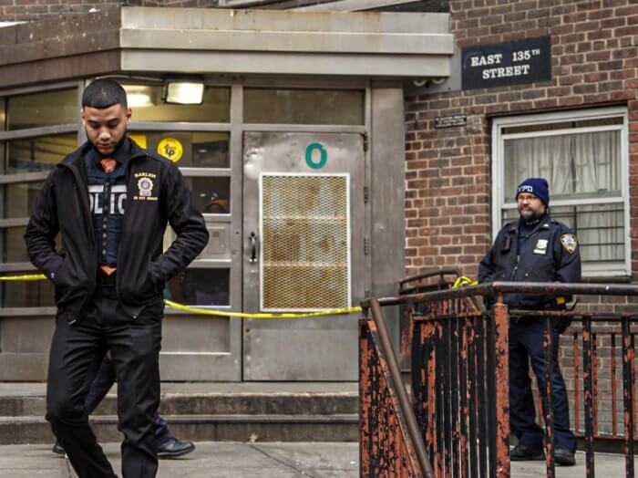 Police investigate where a woman was shot in Harlem.