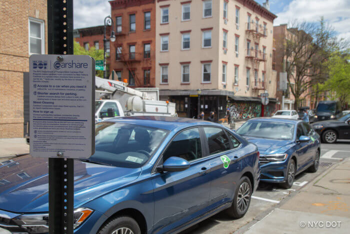 Parking spaces in new york city filled with cars