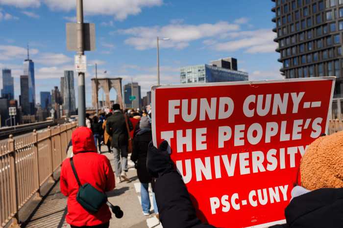 Students, teachers, union members and elected officials march over the Brooklyn Bridge