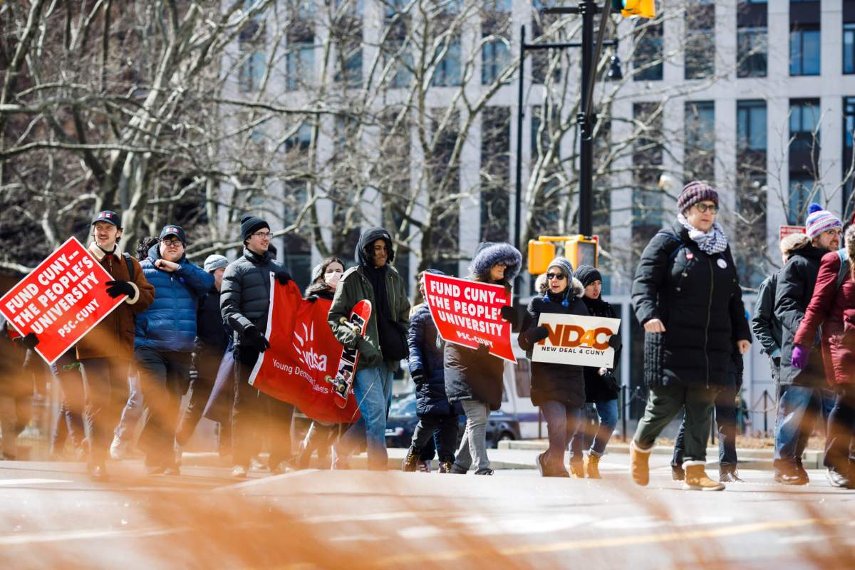 Students, teachers, union members and elected officials march toward the Brooklyn Bridge.