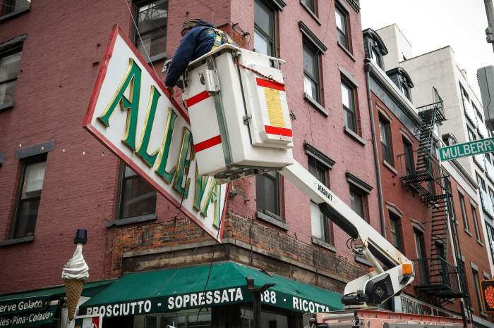 Avella Cheese Shop's sign coming down