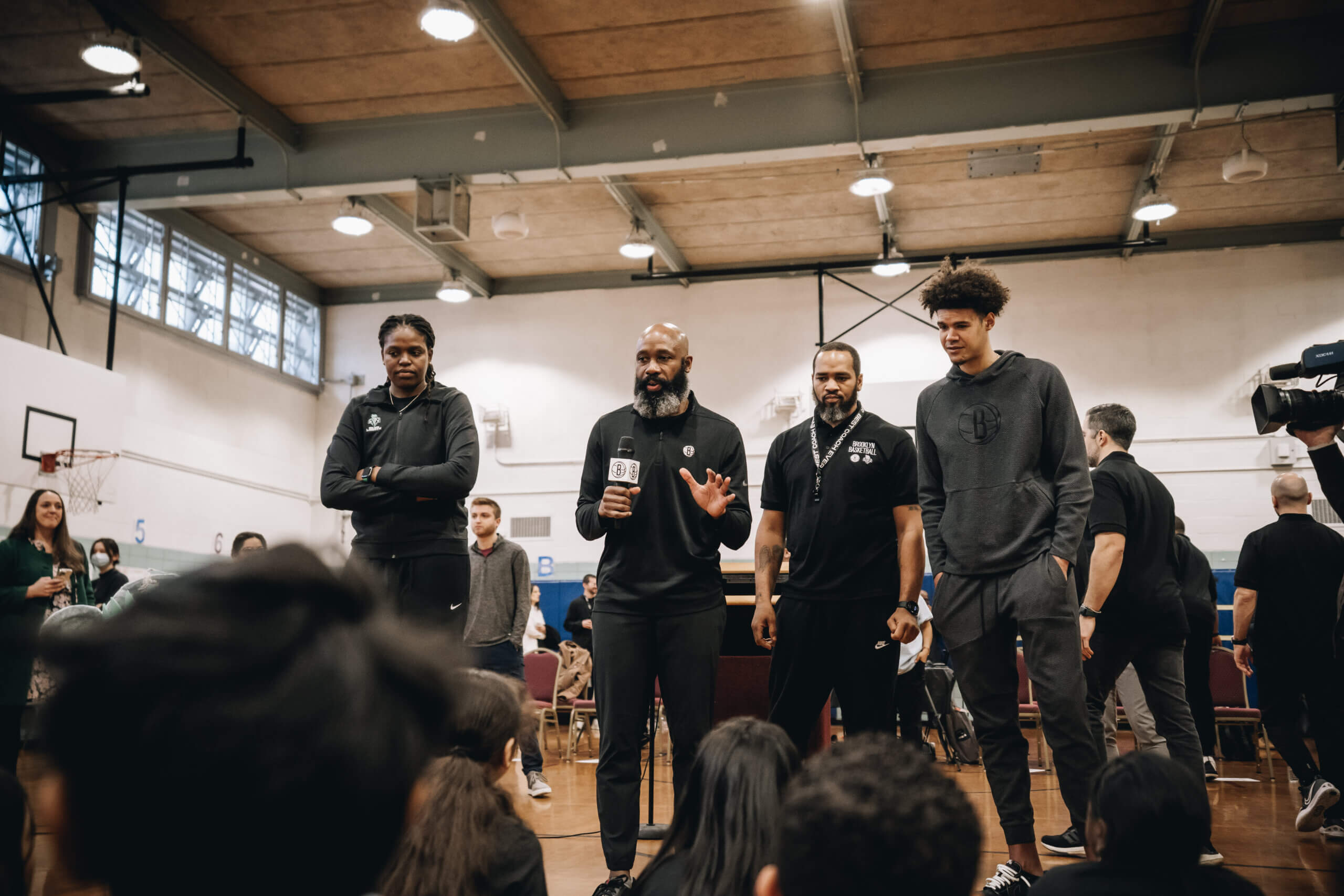 New York Liberty center Jonquel Jones, Brooklyn Nets Head Coach Jacque Vaughn, Head Clinician for the Brooklyn Nets Basketball Academy Dell Bethea, and Nets forward Cameron Johnson speak to students
