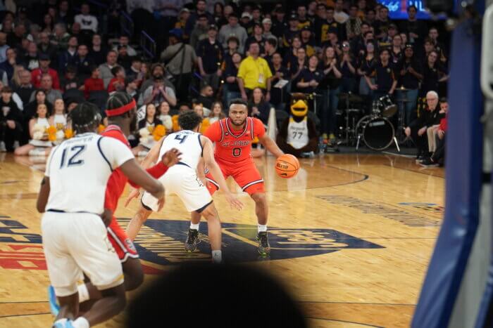 St. John's guard Posh Alexander looks to drive the ball