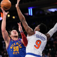 RJ Barrett of the Knicks defends Aaron Gordon