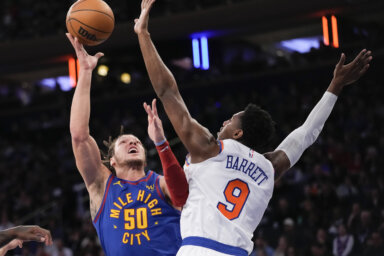 RJ Barrett of the Knicks defends Aaron Gordon
