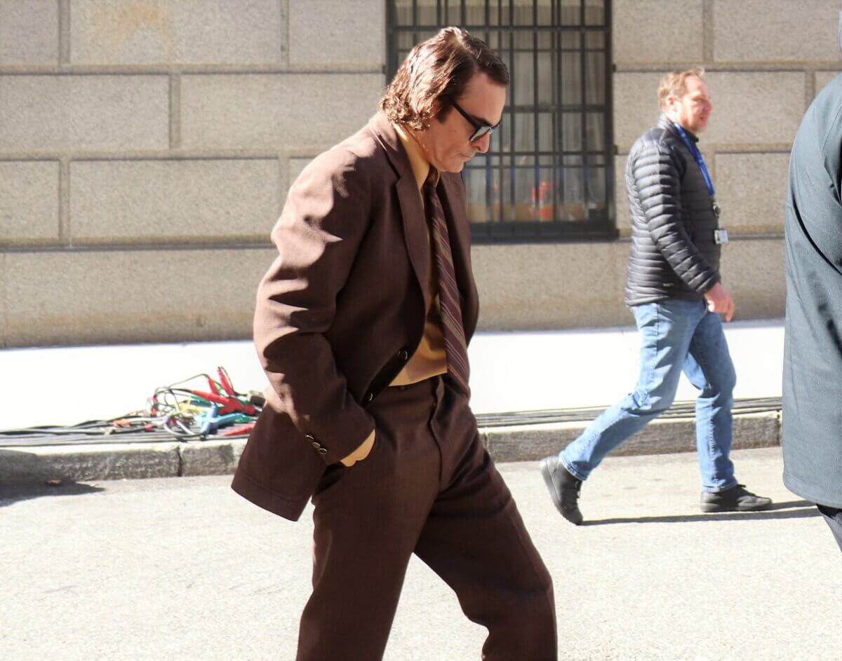 Joaquin Phoenix, who plays Joker, walks to the set of Joker 2, "Joker: Folie à Deux." (Photo by Michael Dorgan)