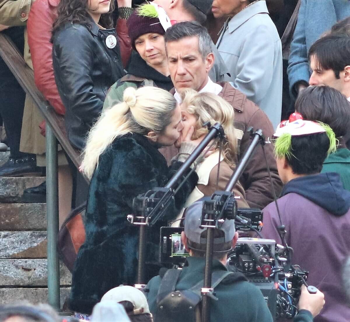 Lady Gaga, who plays Harley Quinn, plants a kiss on a woman on the set of Joker 2, "Joker: Folie à Deux" (Photo by Michael Dorgan)