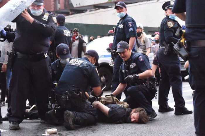 Members of the NYPD's Strategic Response Group arrest
