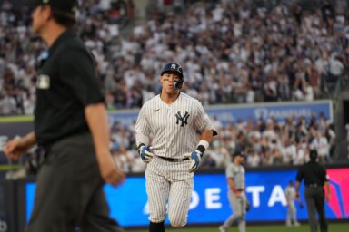 Aaron Judge trots around the bases after hitting a solo home run in the first inning of the Yankees game against the Minnesota Twins on April 14, 2023.