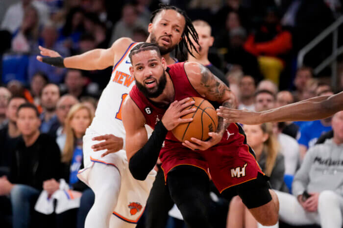 Jalen Brunson of the Knicks defends against the Heat