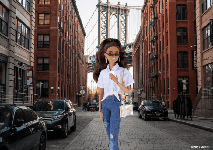 A Barbie doll walking through New York City.