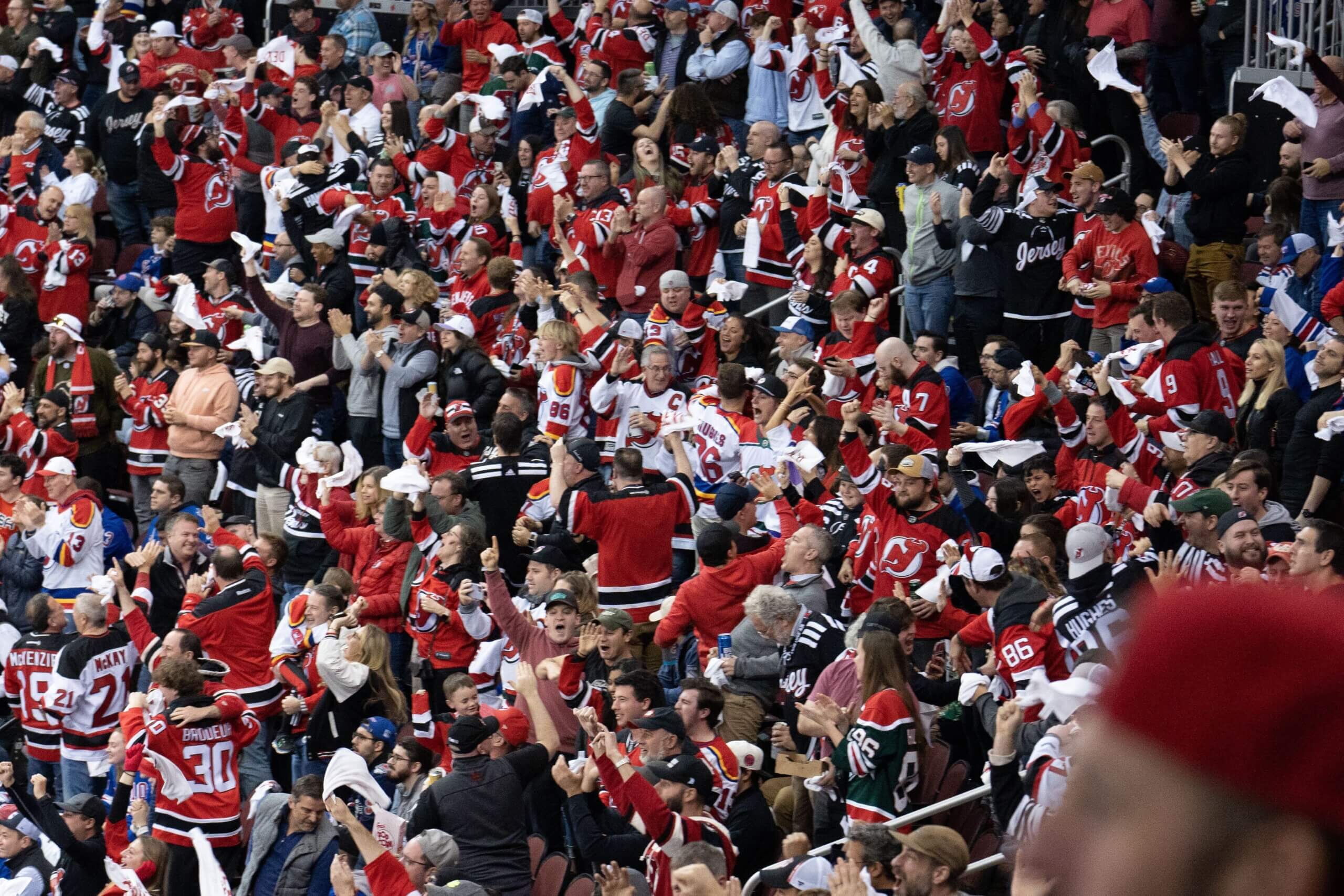 Devils fans celebrate a goal in the second period of the first round of the Stanley Cup Playoffs against the Rangers on May 1, 2023.