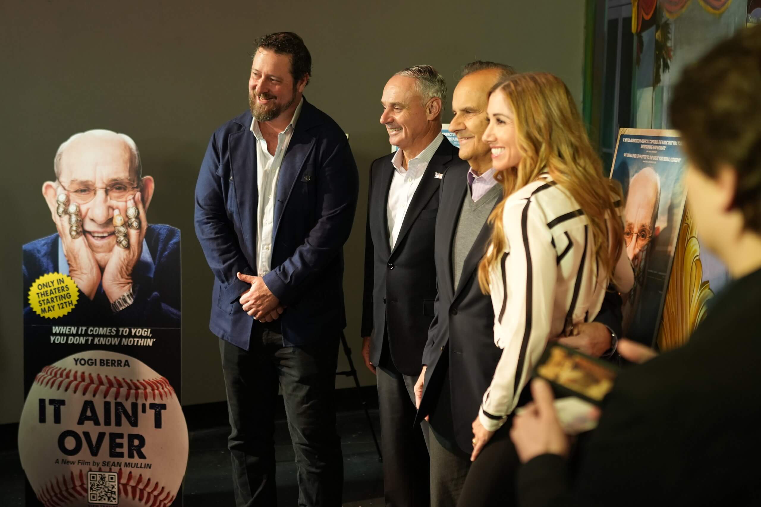 Director poses with MLB commissioner Rob Manfred, former Yankees manager Joe Torre and Lindsey Berra, the granddaughter of baseball legend Yogi Berra.