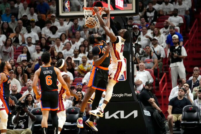 Bam Adebayo dunks over Mitchell Robinson of the Knicks