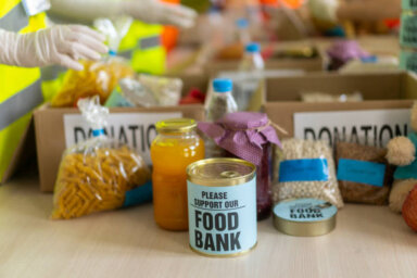 People collecting food for poor people in homeless shelter
