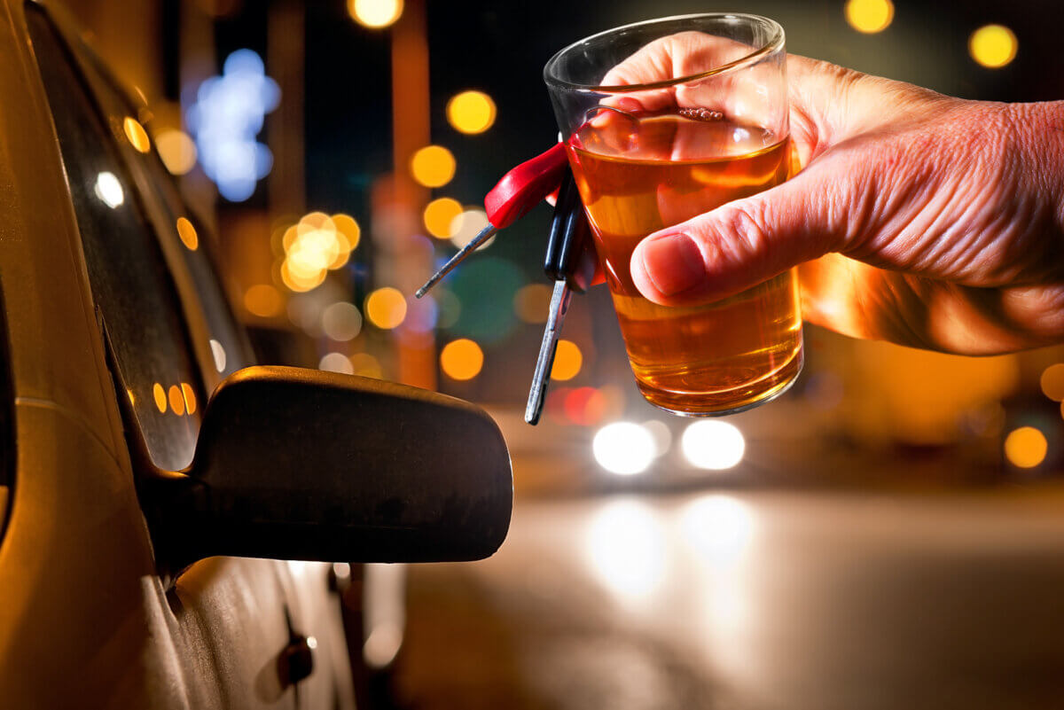 hard drinker with liqueur glass by night