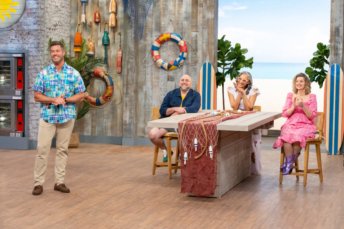 Judges Duff Goldman, Carla Hall, Damaris Phillips, and Host Jesse Palmer (far left) deliver results to contestants, as seen on "Summer Baking Championship."