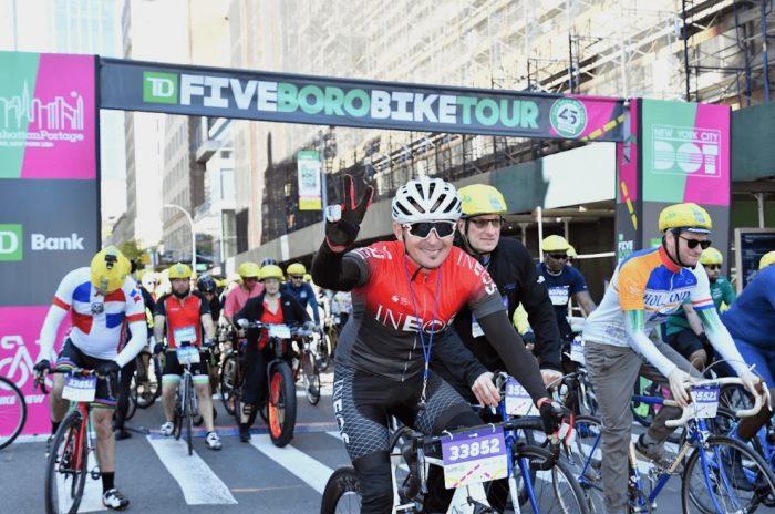 Five Boro Bike Tour draws riders from around the world for 40 mile trek 4 A rider gives a peace sign near the starting line of the 2023 Five Boro Bike Tour