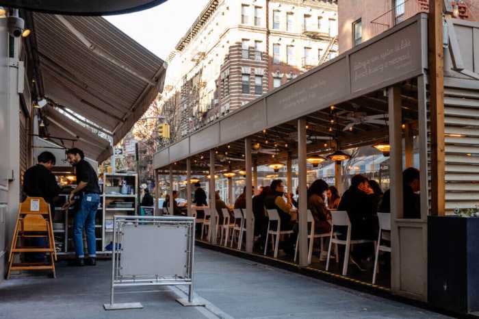 The dining shed of Mermaid’s Oyster Bar on MacDougal Street in the Village filled with customers.