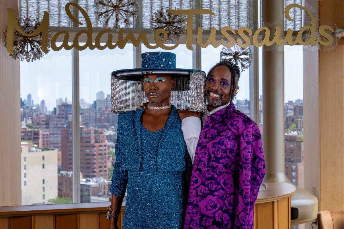 Billy Porter stands with his wax figure.