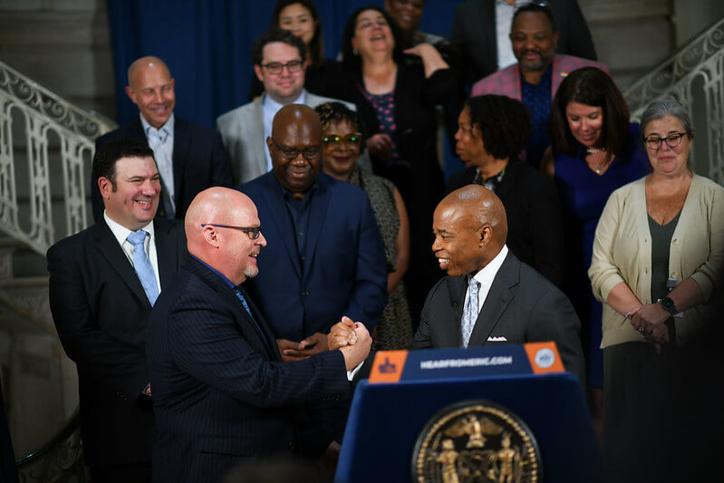 Mayor Eric Adams and UFT President Michael Mulgrew shake hands on 5-plus year labor deal reached between the city and teacher's union.