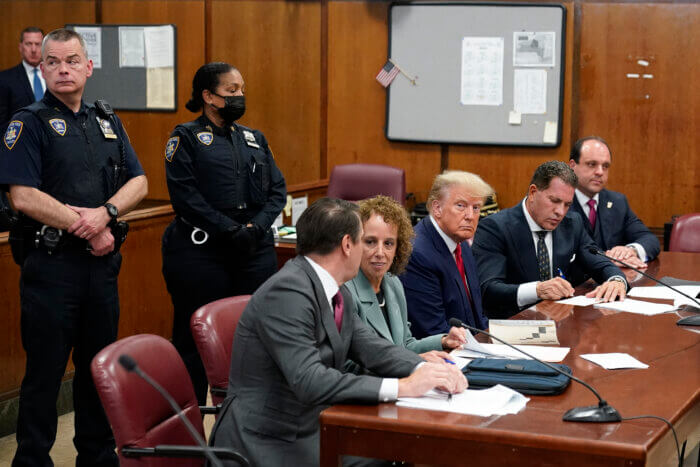 Donald Trump at arraignment with his lawyers