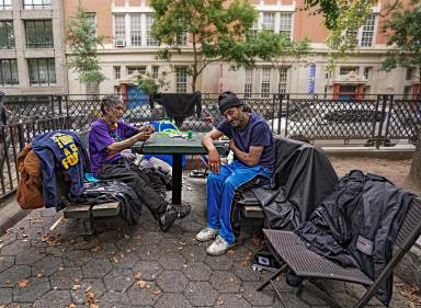 Two homeless men at an encampment in Lower East Side park