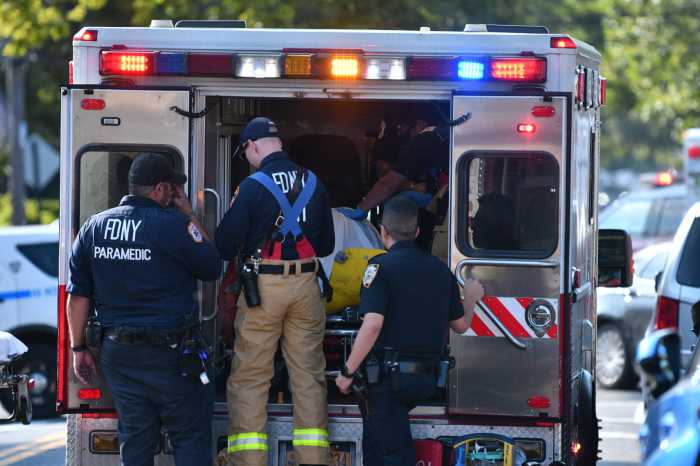FDNY EMT paramedics load an ambulance
