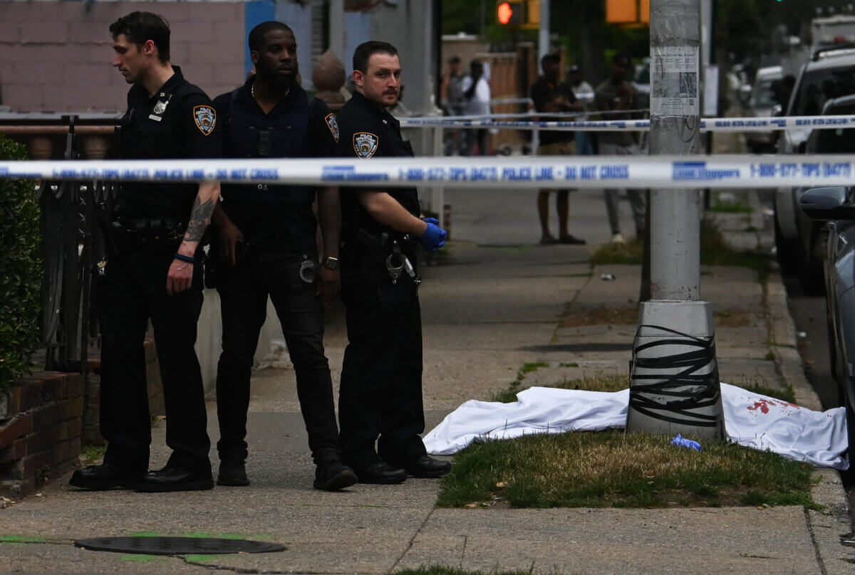 Brooklyn police watch over body of man shot dead