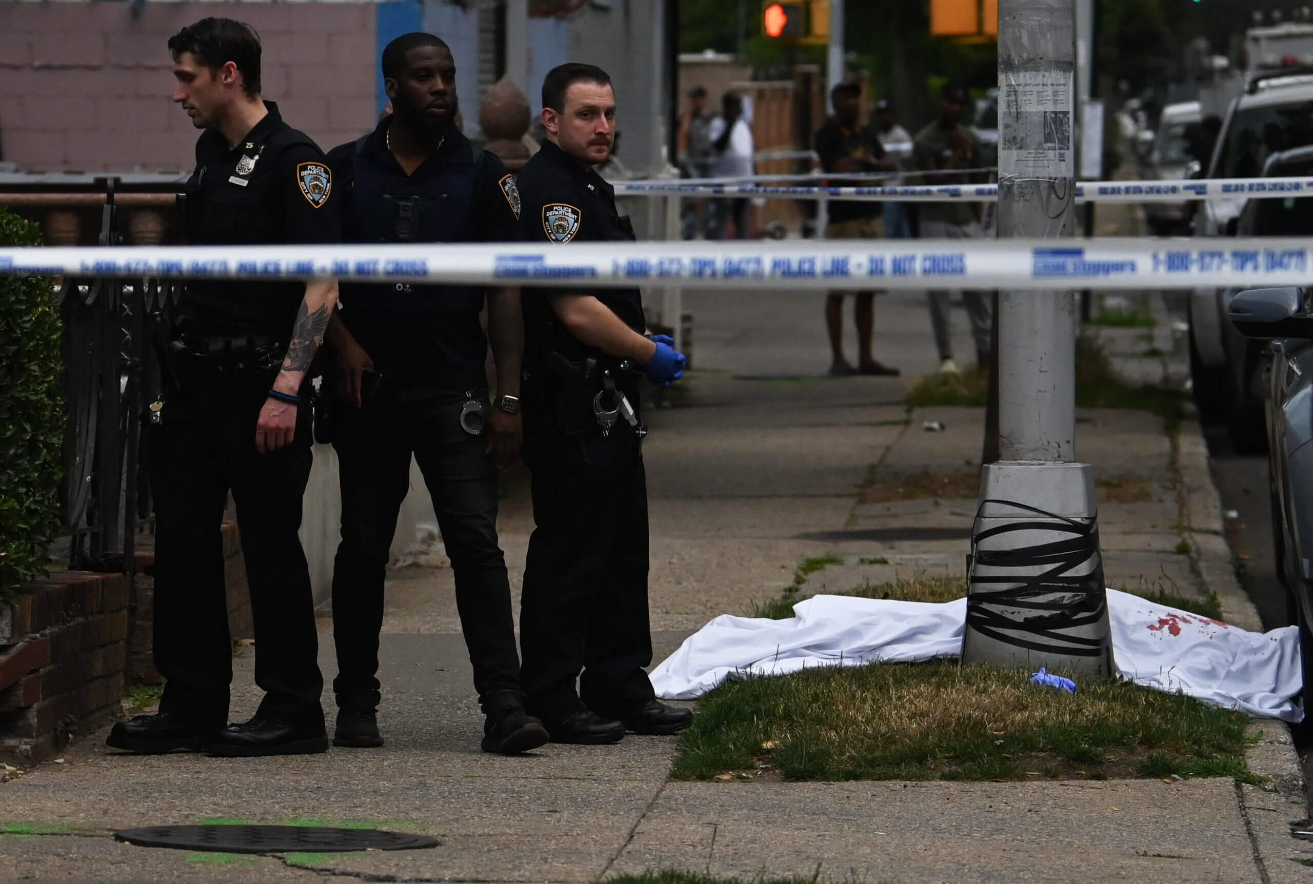 The sound of silence: Four more Brooklyn NYPD precincts pull plug on radio frequencies in encryption effort 3 Brooklyn police watch over body of man shot dead