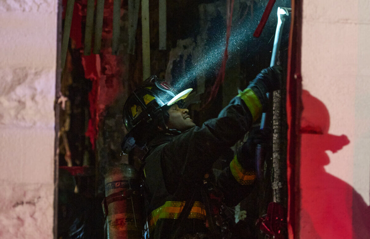 Brooklyn firefighter tears into wall of burning home