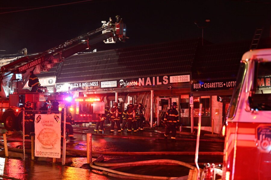 Fire tears through row of Staten Island stores, 1 firefighter injured