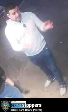 man pictured wanted for a racist attack