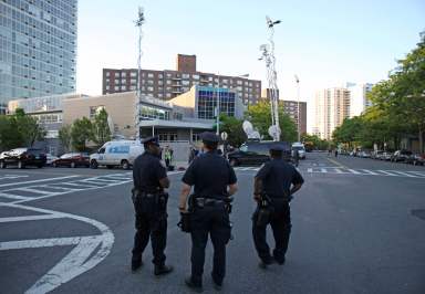 NYPD officers stand guard after post-9/11 terror probe