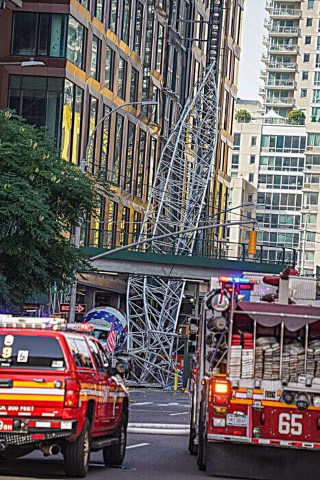 A crane caught fire and partially collapsed on 10th Avenue in Midtown Manhattan on July 26.
