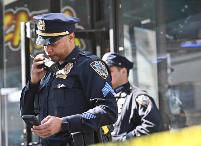 NYPD officers use radio