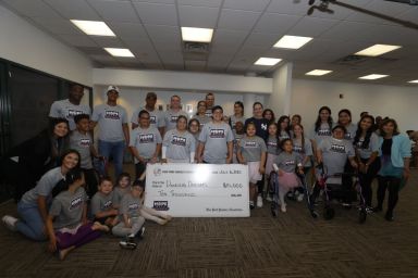 Group-Shot-with-Check-Donation-from-Yankees-1200×800-1