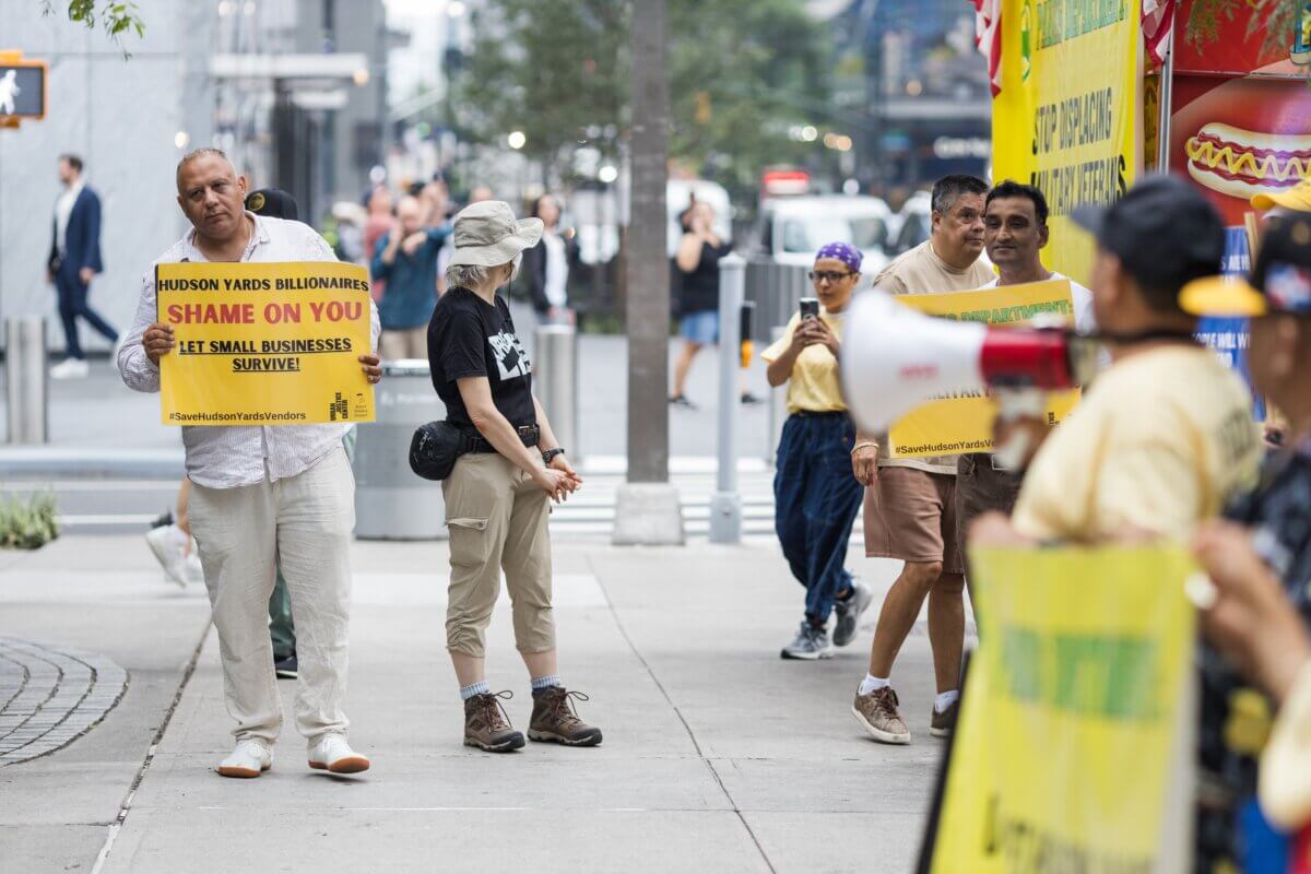 Street vendors and supporters march through Hudson Yards against the local BID