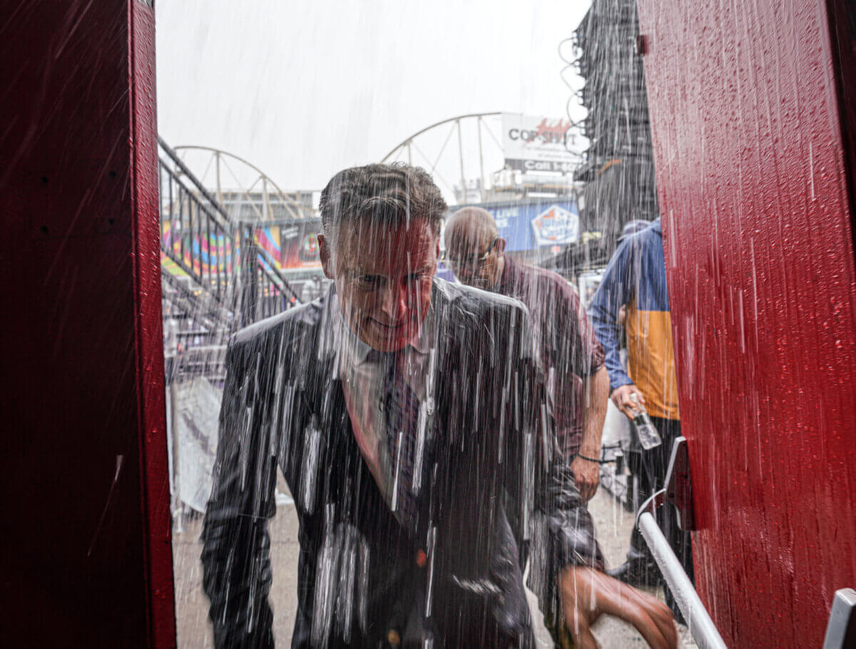 Nathan’s hot dog eating contest master of ceremonies George Shea soaked after thunderstorm
