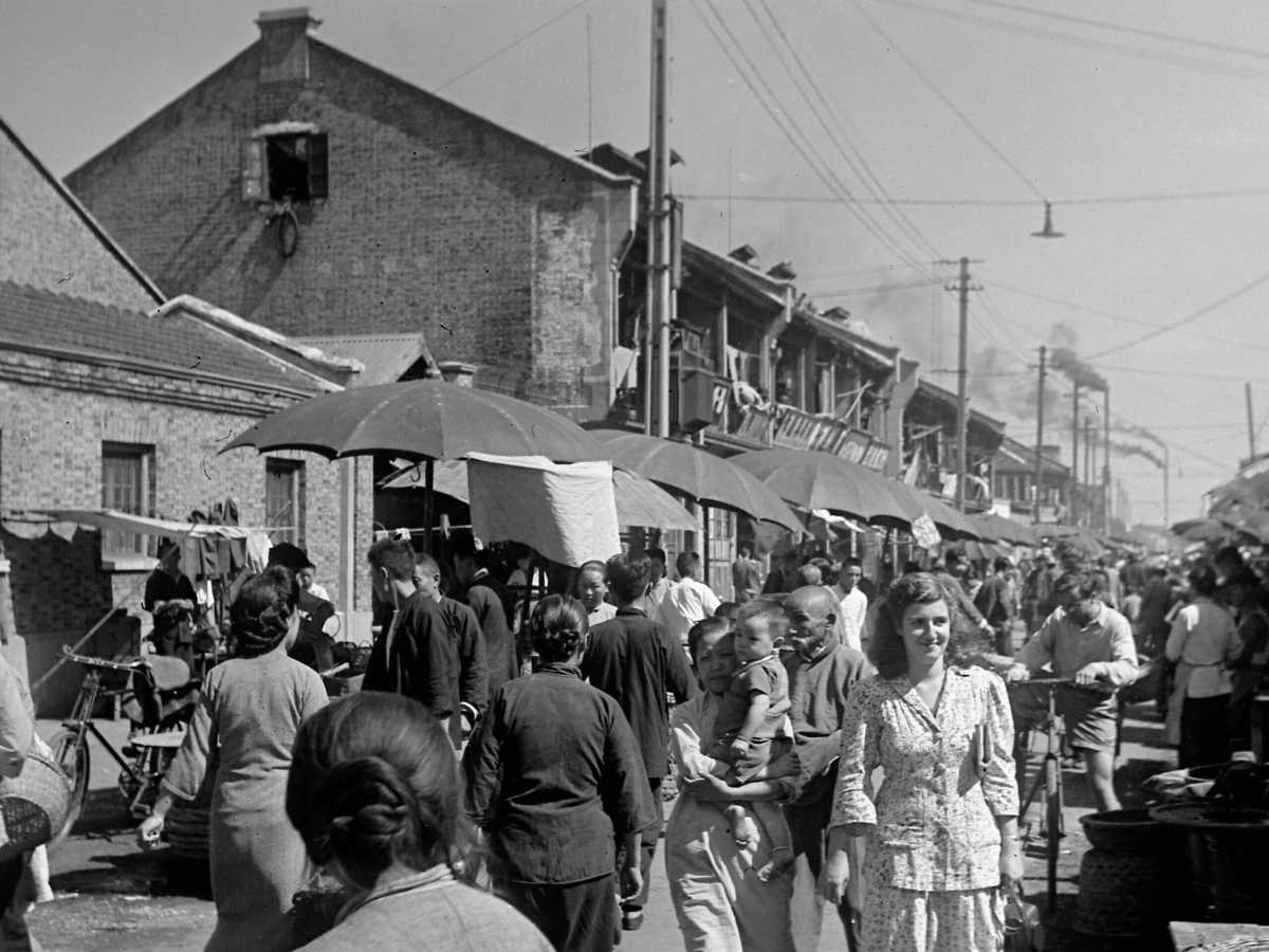 Jewish refugees and their Chinese neighbors at a market in Hongkou
