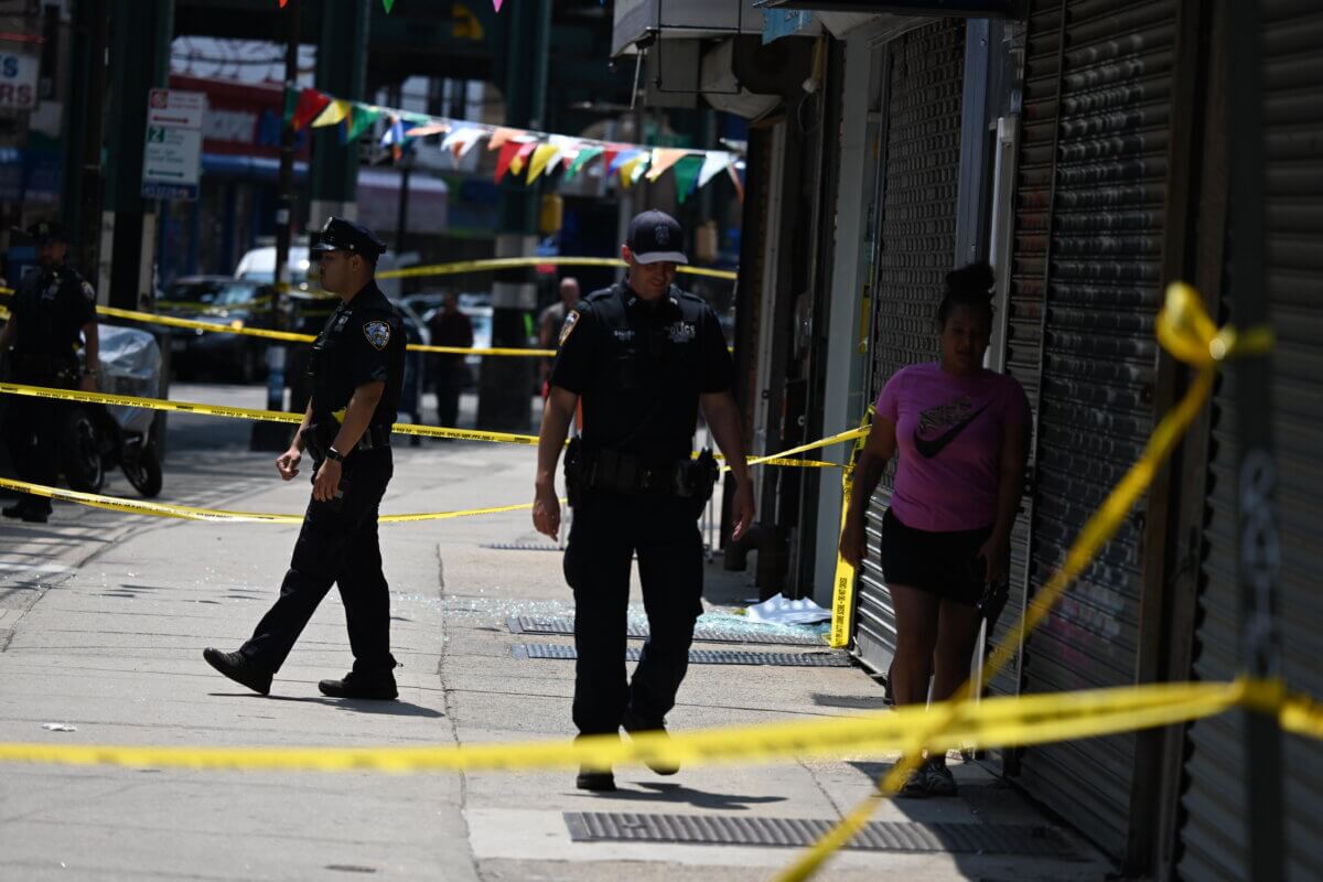 Police officers at Queens shooting spree scene